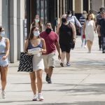 people maintaining social distancing while travelling