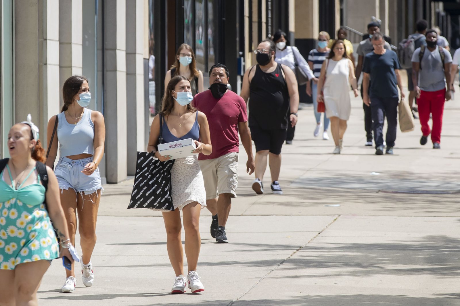 people maintaining social distancing while travelling