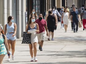 people maintaining social distancing while travelling