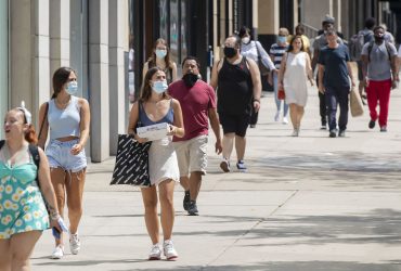 people maintaining social distancing while travelling