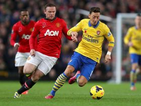 Wayne Rooney vs Mesut Ozil playing football, one of the most popular sports in 2021