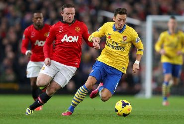 Wayne Rooney vs Mesut Ozil playing football, one of the most popular sports in 2021