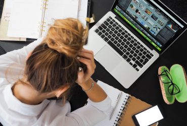 Woman frustrated with excess work pressure